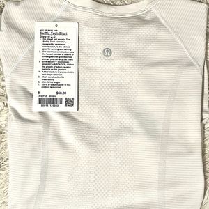 white lululemon swiftly tech never worn still have the tag !